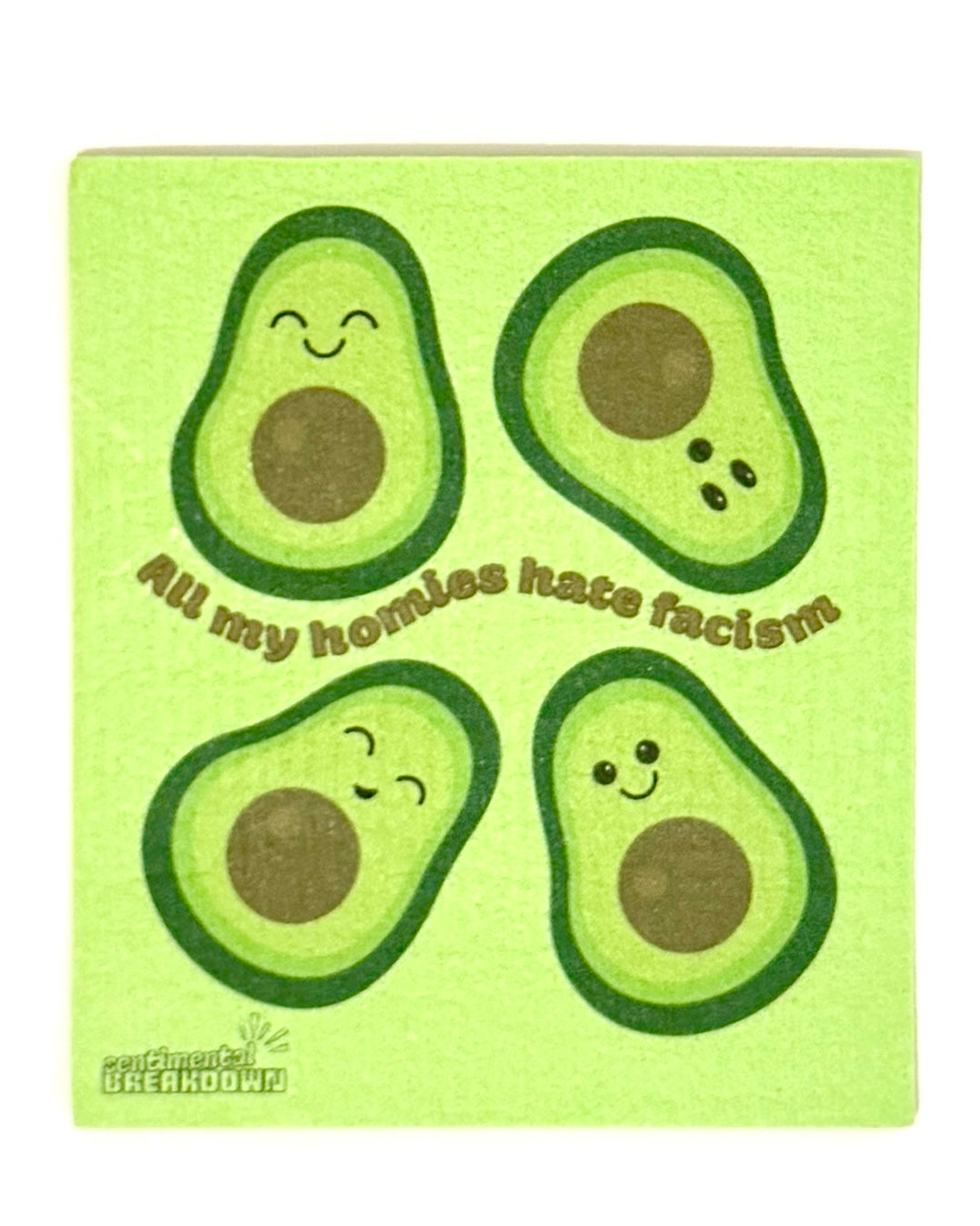 A square green dish towel with a ribbed texture, featuring four cartoon avocado faces and the text 'All my homies hate facism!' in brown script. The towel is photographed flat against a plain off-white background.