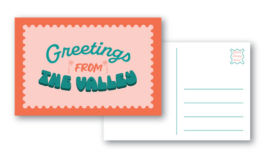 A postcard set showing the front and back on a white background. The front has a pink background with a blue border and the text 'Greetings from THE VALLEY'.
