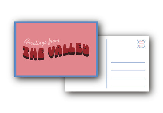 A postcard set showing the front and back on a white background. The front has a pink background with a blue border and the text 'Greetings from THE VALLEY' in red and black.